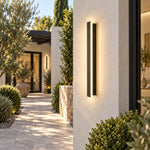 Black linear sconce garden entrance scene