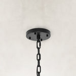 Black chandelier ceiling canopy and hanging chain close view