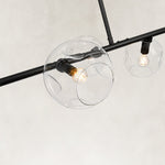 Black chandelier glass globes and light sockets close view