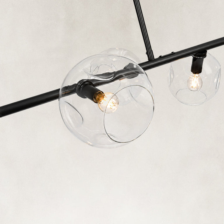 Black chandelier glass globes and light sockets close view