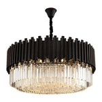 Black fin and crystal drum chandelier with its ceiling canopy against a white background.