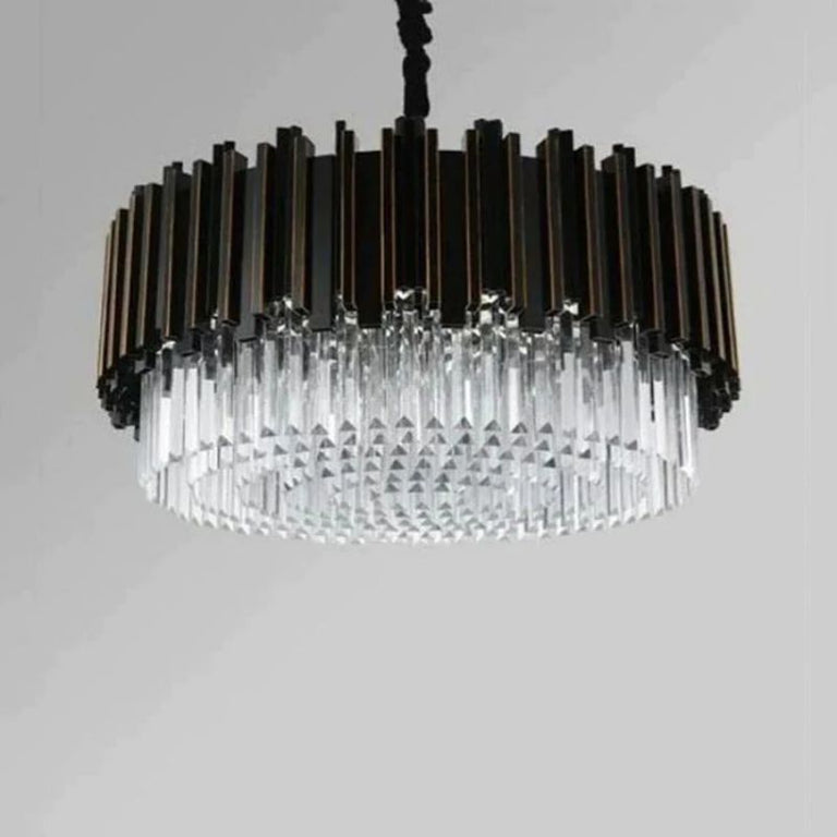 Round black fin chandelier with hanging crystal rods against a neutral background.