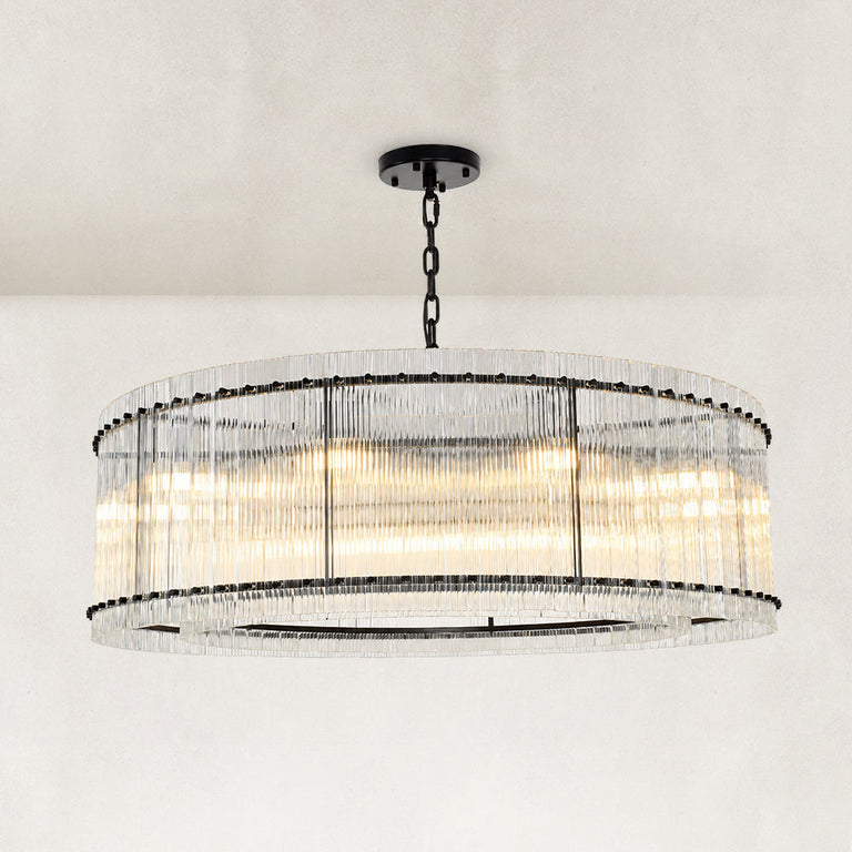 Black glass rod drum chandelier complete fixture illuminated against a light background