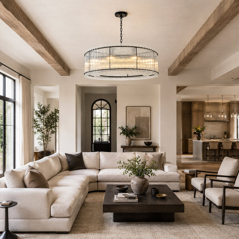 Black glass rod drum chandelier in a living room with exposed ceiling beams