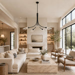 Black leaf glass chandelier in a living room with large windows