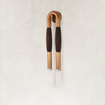 Unlit Brown wall sconce with a U-shaped frame