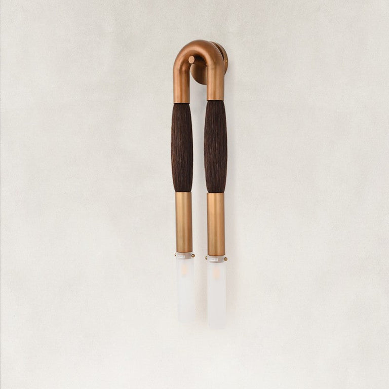 Unlit Brown wall sconce with a U-shaped frame