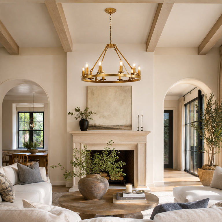 Candle ring chandelier in a living room with a fireplace and arched doorways.