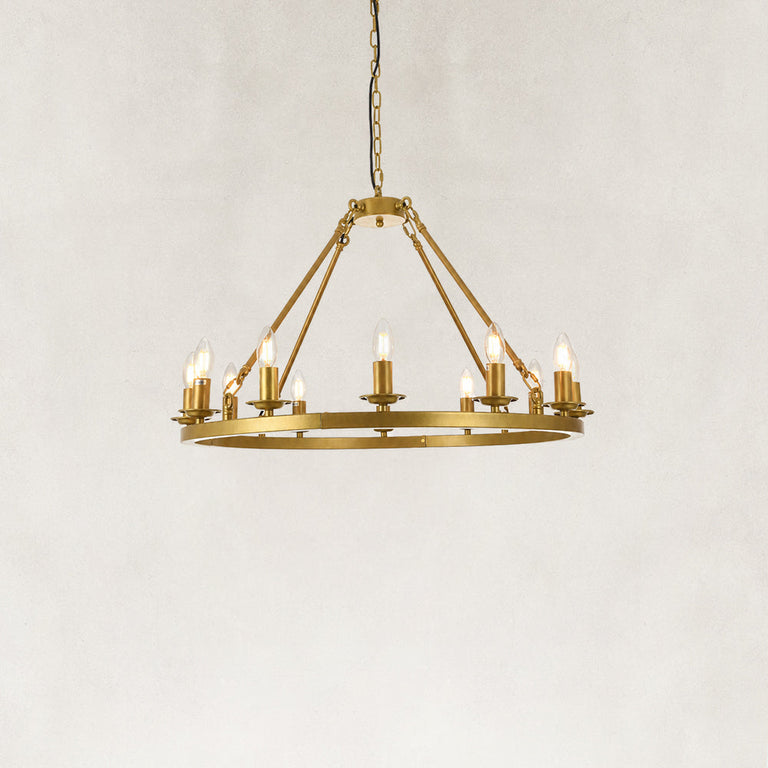 Gold-tone candle ring chandelier, illuminated complete product view.