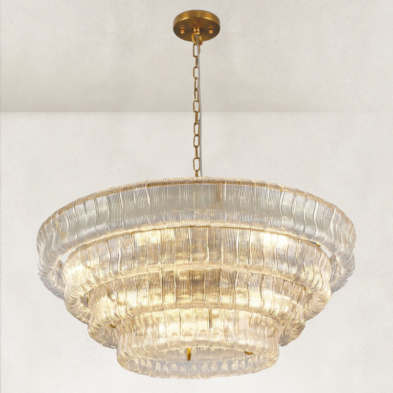 Clear fluted-glass round chandelier viewed from below.