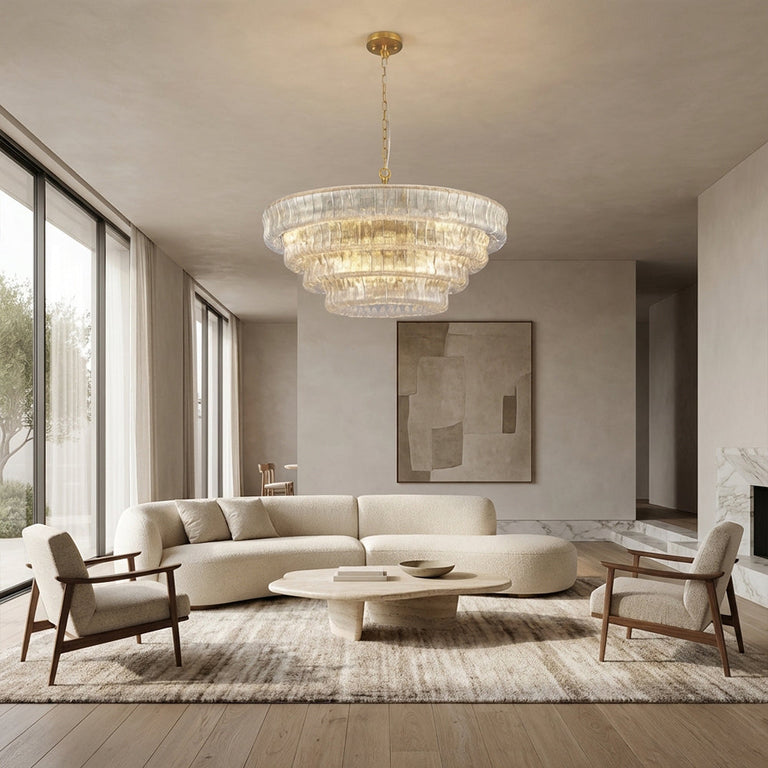Clear round chandelier in a neutral living room.