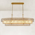 Clear glass linear chandelier with its canopy and chains.