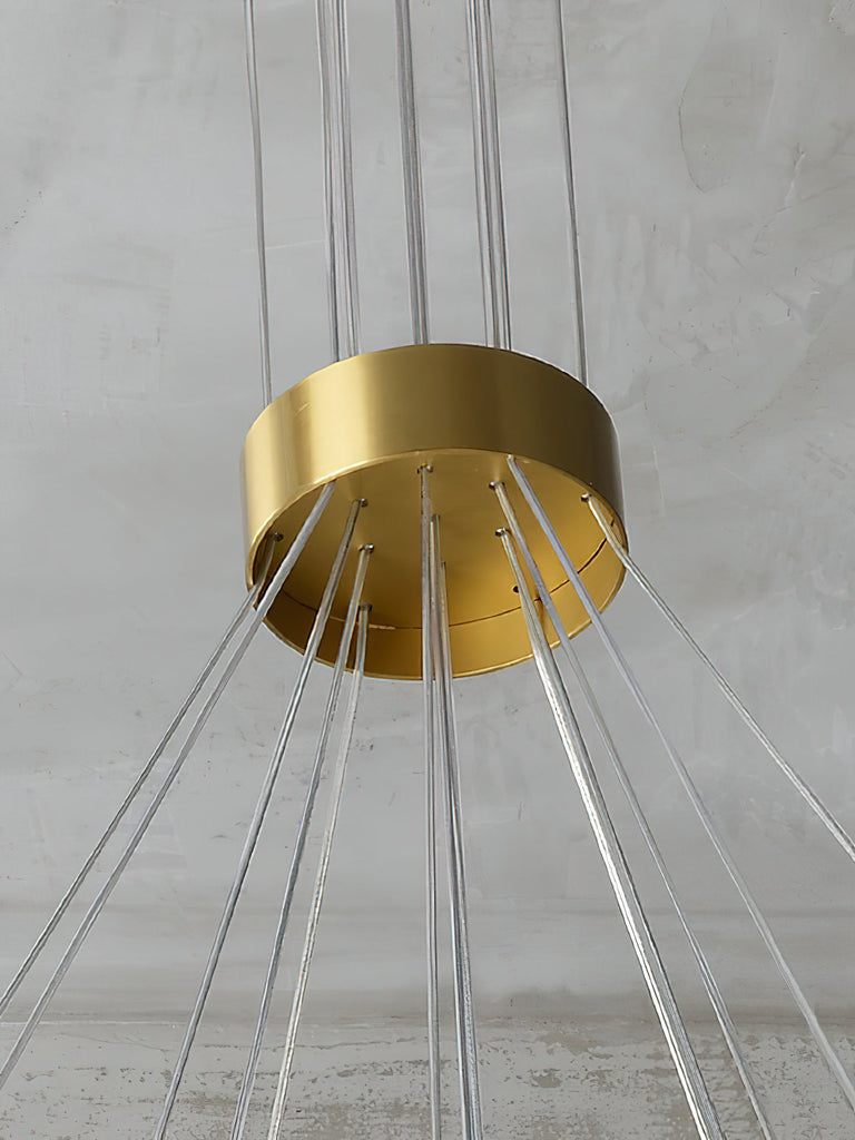 Close-up of the circular brass-colored suspension hub with radiating wires