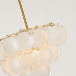 Illuminated petal glass chandelier, upper glass panels and rod close view.