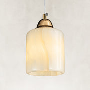 Cloud Onyx Cylinder Pendant illuminated as a complete fixture