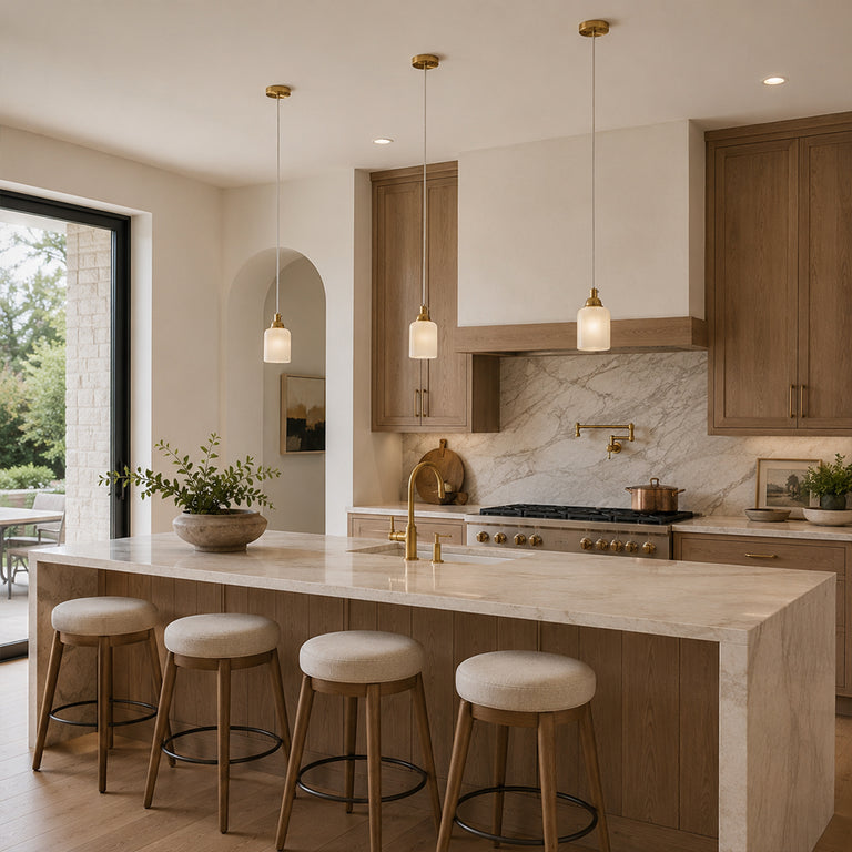 Cloud Onyx Cylinder Pendant illuminated in a warm kitchen interior