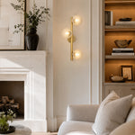 Brass-Tone Three-Globe Wall Sconce brass-tone room scene