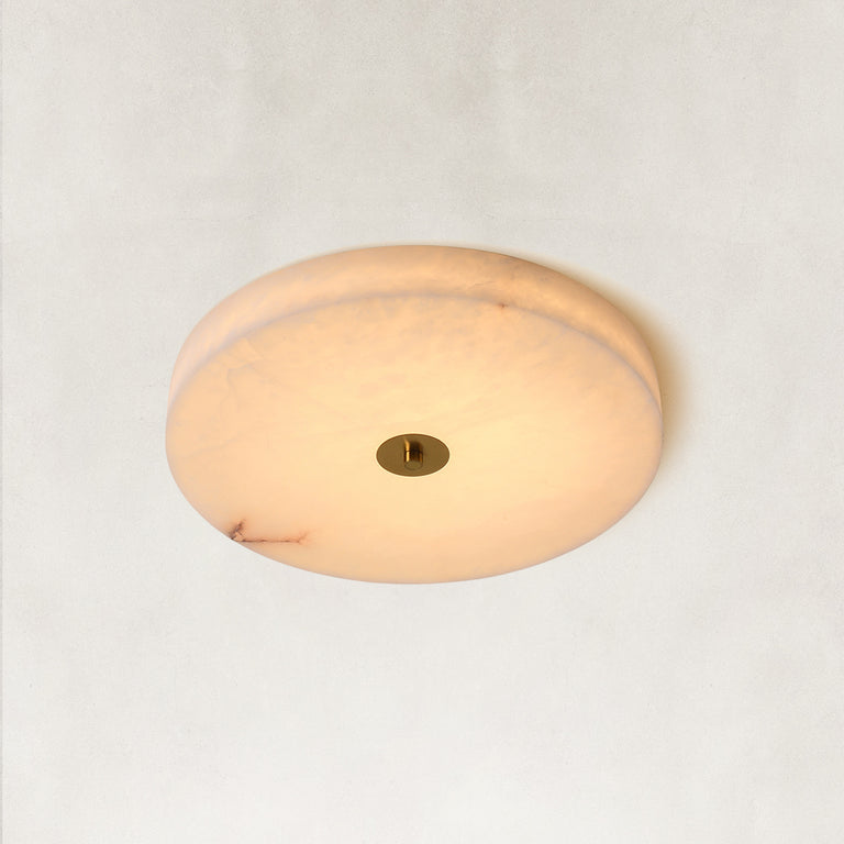 Illuminated Cora alabaster ceiling light against a neutral background