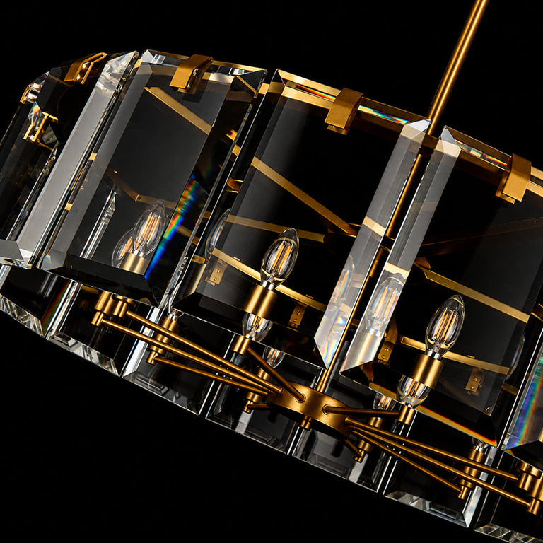 Angled close-up of a brass-tone drum frame and clear crystal bars.