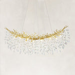 Complete linear branch chandelier with brass-tone framework and hanging clear crystals.