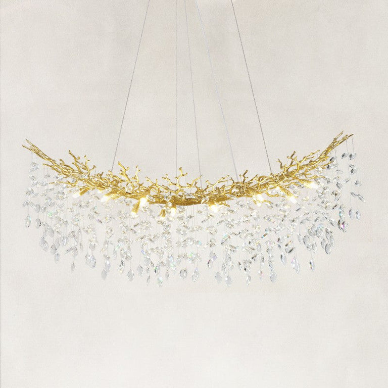 Complete linear branch chandelier with brass-tone framework and hanging clear crystals.