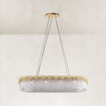 Complete gold-tone chandelier with canopy and suspension cables.