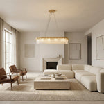 Gold-tone crystal-glass chandelier in a living-room setting.
