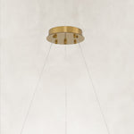 Brass-tone round canopy and suspension-wire detail.