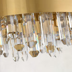 Lower faceted rods beneath the oval chandelier band.