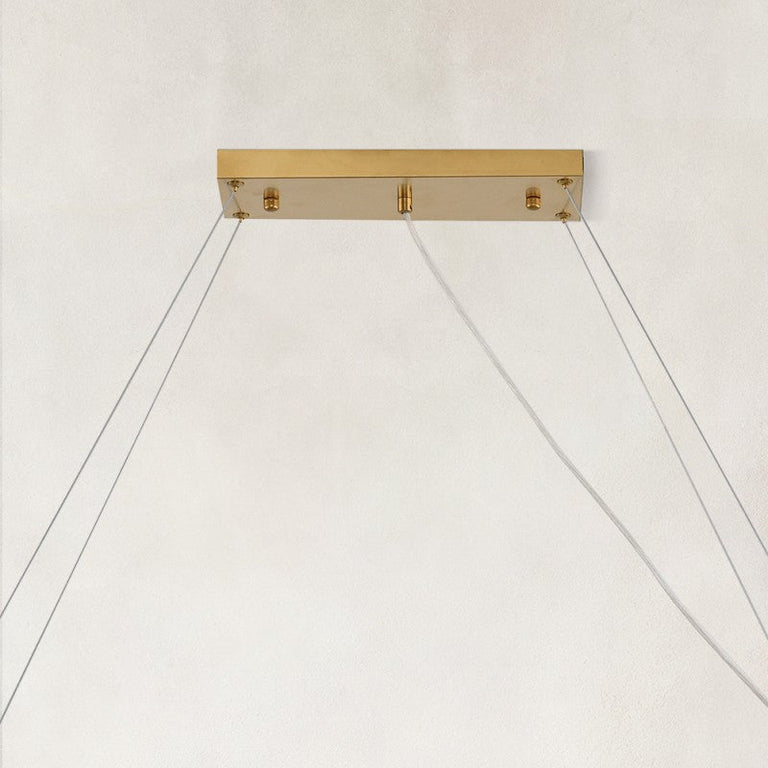 Rectangular chandelier canopy and suspension cables.