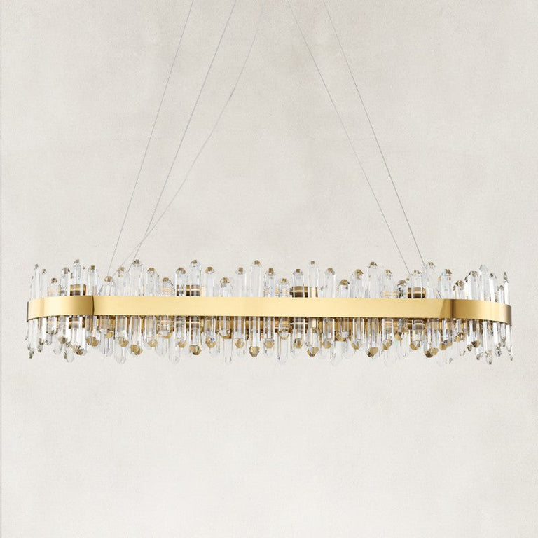 Unlit oval chandelier with a gold-tone band and clear rods.