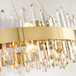 Illuminated clear rods beneath the round chandelier band.