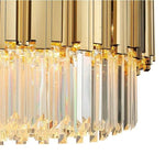 Detail of gold-tone vertical fins above the hanging crystal fringe.