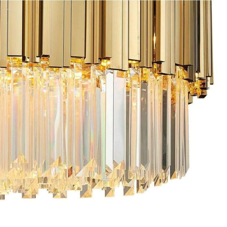 Detail of gold-tone vertical fins above the hanging crystal fringe.