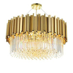 Gold-tone crystal drum chandelier with hanging rods against a white background.