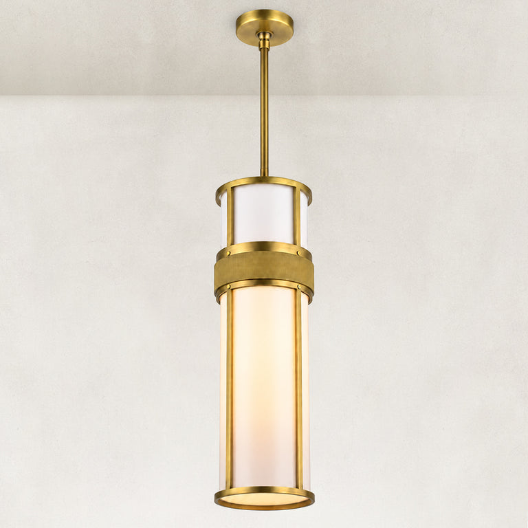 Cylindrical pendant with a white acrylic diffuser, gold-tone frame and single suspension rod.
