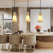 Three Canto Tapered Pendants suspended separately in a furnished interior