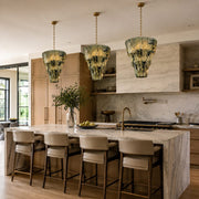Marble pendant lights above a kitchen island