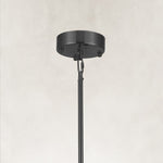 Black ring chandelier, ceiling canopy, chain and rod close view.