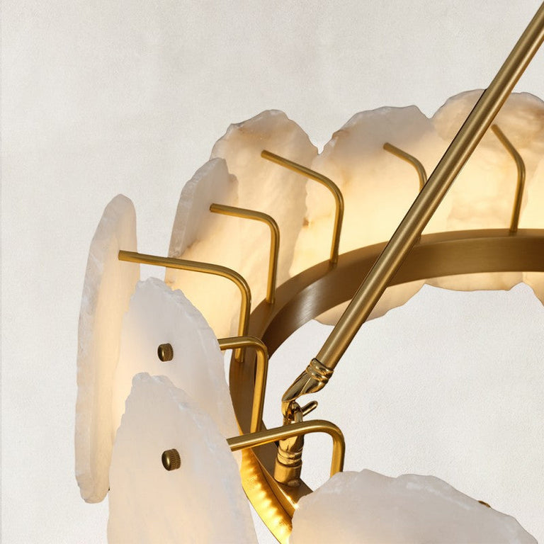Gold-tone ring chandelier, panel brackets and angled support arm detail.