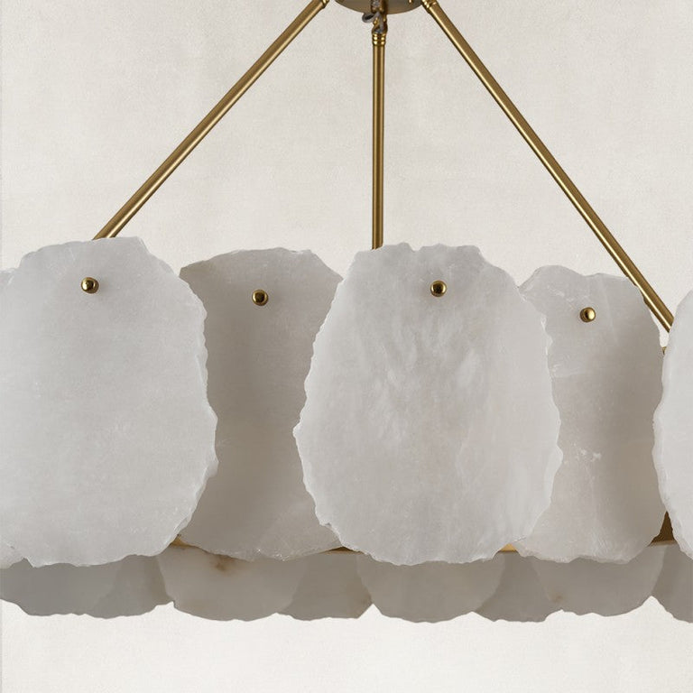 Gold-tone ring chandelier, white panels and suspension arms close view.