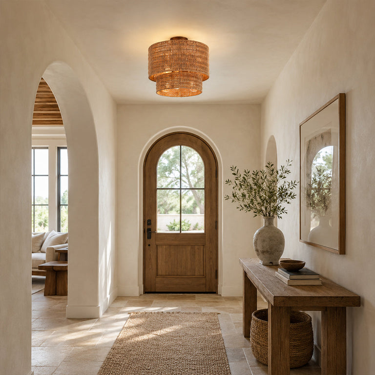 Natural rattan tiered flush mount illuminated in an entryway