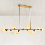 Illuminated linear disc chandelier viewed from a low oblique angle.