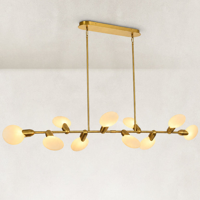 Illuminated linear disc chandelier viewed from a low oblique angle.