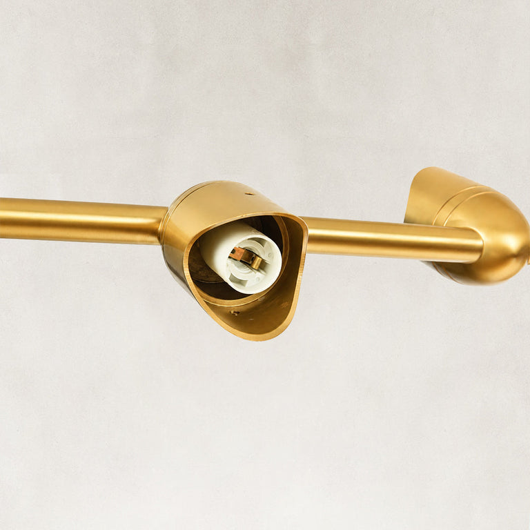 Linear disc chandelier, empty socket inside a gold-tone shade holder.