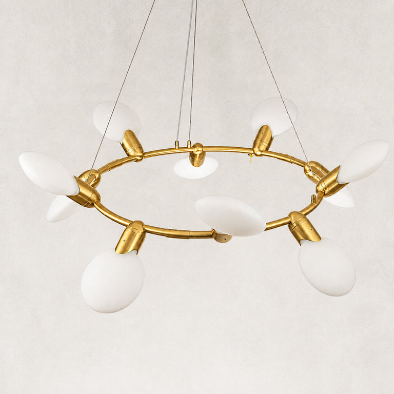Gold-tone ring chandelier detail.
