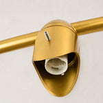 Gold-tone ring chandelier detail.