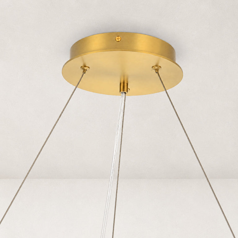Gold-tone ring chandelier detail.