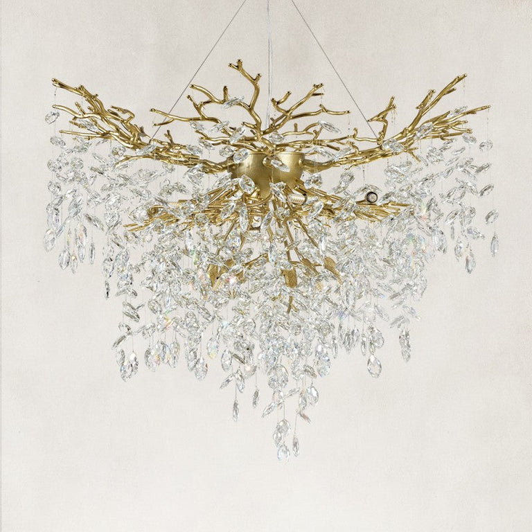 Unlit brass-finish crystal branch chandelier with a deep cascade of drops