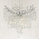 Illuminated silver-finish crystal branch chandelier with a deep cascade of drops